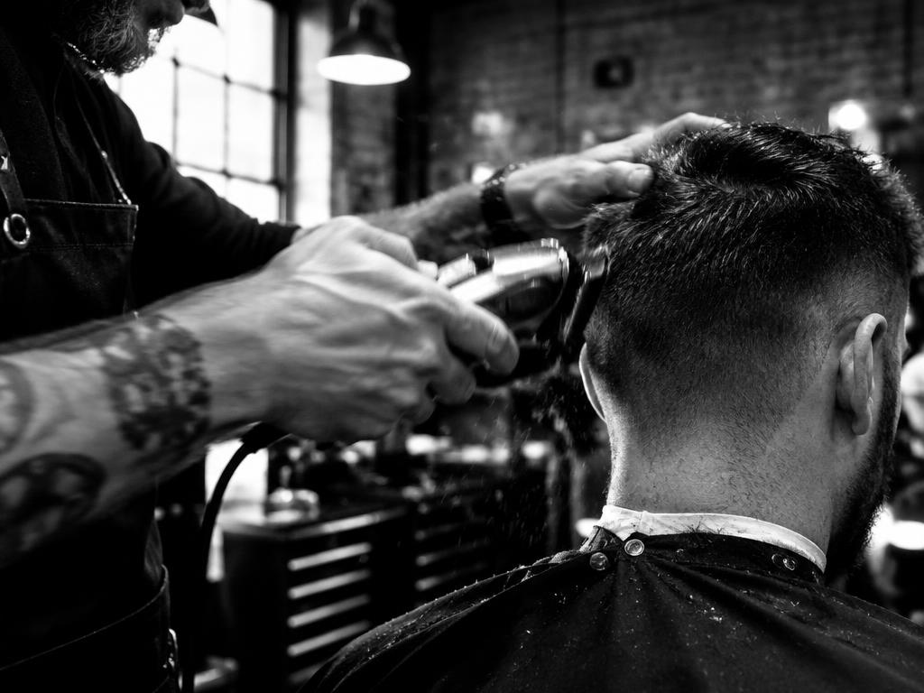 Barber working with clippers